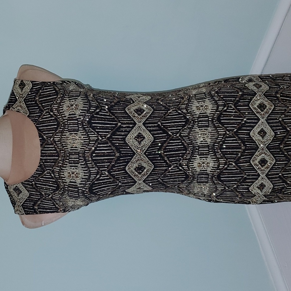 Olivia Matthew's black and gold dress
